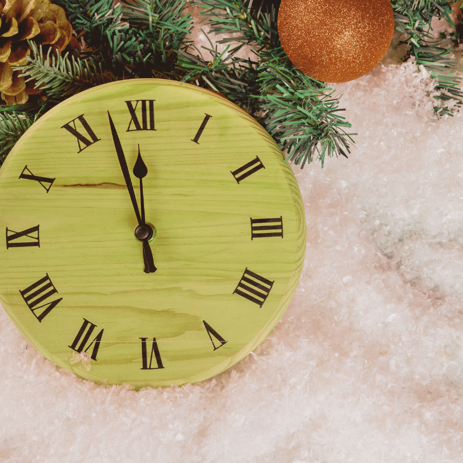 Clock surrounded by Christmas decorations representing holiday time pressure and anxiety triggers, addressed by Orlando anxiety therapist