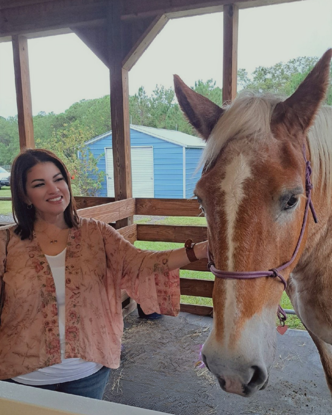 Jennifer Sierra with therapy horse Goldie